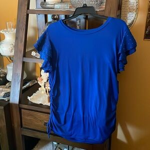 Short sleeve pretty top day 3x but it is more like 1x.  No tags never worn.